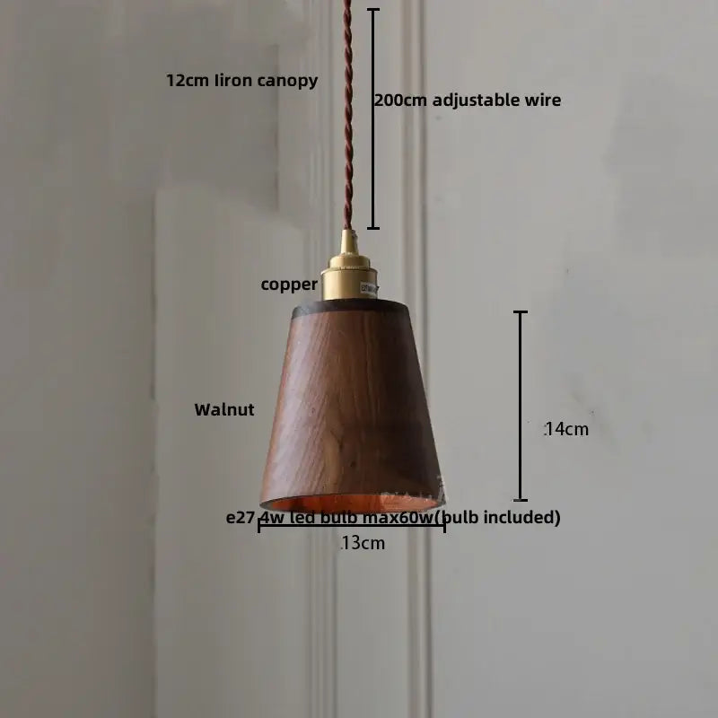Modern walnut wood pendant light with warm-toned wood, copper-finished fixture, and adjustable braided wire for dining room