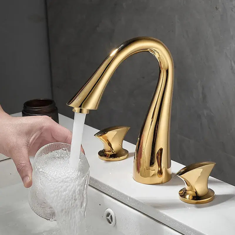 Modern waterfall black and gold basin faucet with sleek curved design and polished finish by decorbites black
