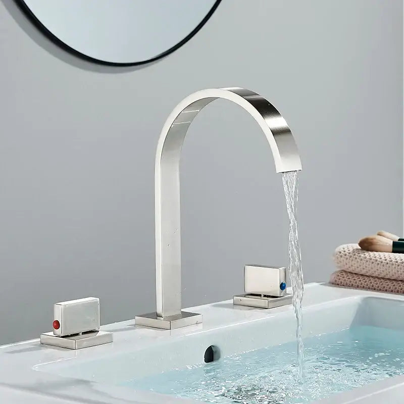 Modern brushed nickel basin faucet with sleek arched waterfall design and dual handles for bathroom decorbites dual handle gold style
