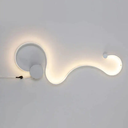 Modern white curved led wall light with sleek organic design and soft ambient glow for stylish living room decor