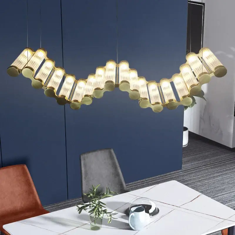 Modern wave decorbites golden chandelier with gold-toned wave design and frosted glass tubes for living room lighting