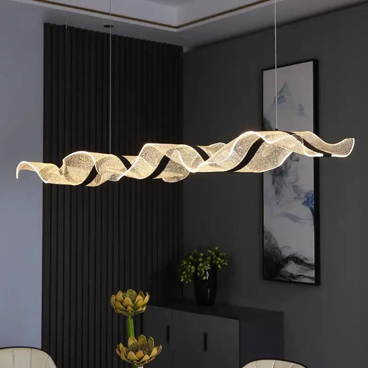 Modern wave glass led pendant light with translucent textured glass and warm golden lighting for dining table in modern interiors