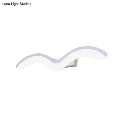 Modern wavelet black and white wall sconce with sleek wave shape and soft lavender LED glow for bathroom lighting