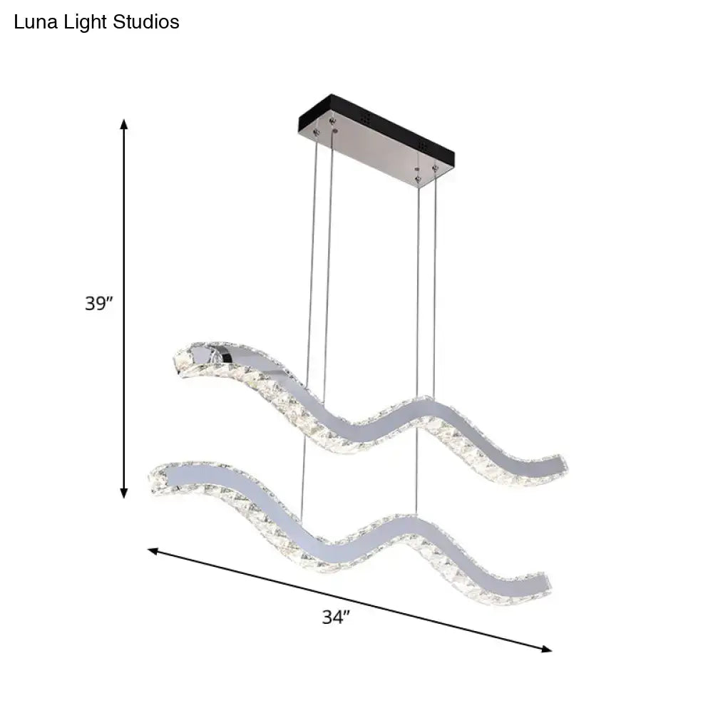 Modern wave-shaped stainless steel hanging light fixture with clear crystal accents and sleek chrome finish for office use