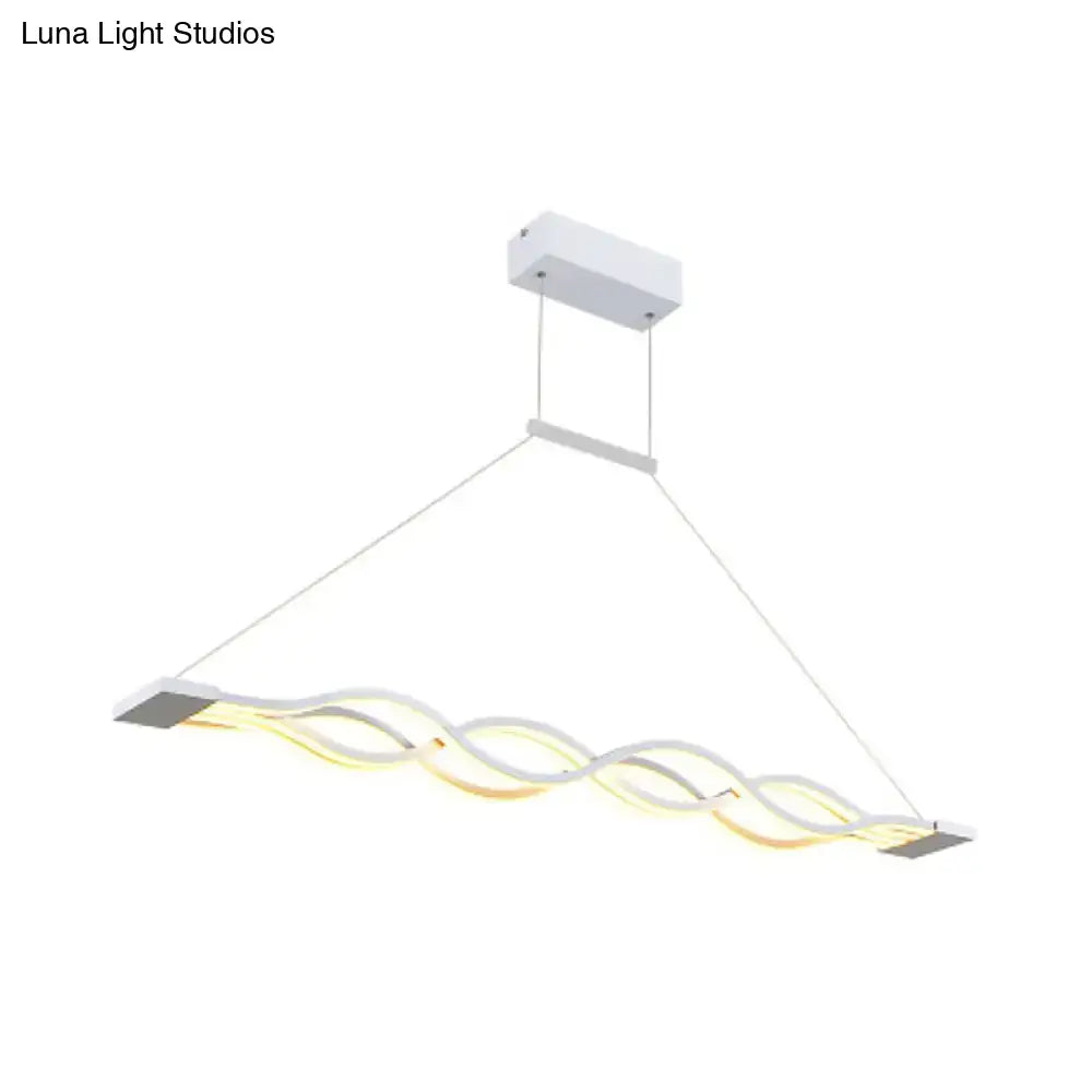 Modern white DecorBites™ acrylic ceiling pendant light with wavy design and warm white illumination for wide variety spaces