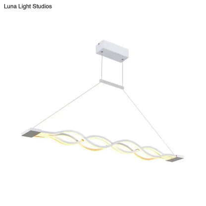 Modern white DecorBites™ acrylic ceiling pendant light with wavy design and warm white illumination for wide variety spaces