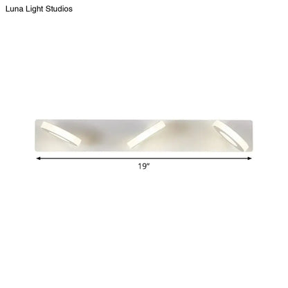 Modern white 3-light adjustable wall light fixture with three sleek angled circular led lights for bathroom use