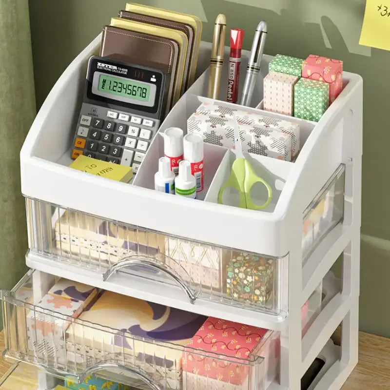 Modern white 4 tier makeup drawer organizer with clear plastic drawers holding stationery and craft supplies