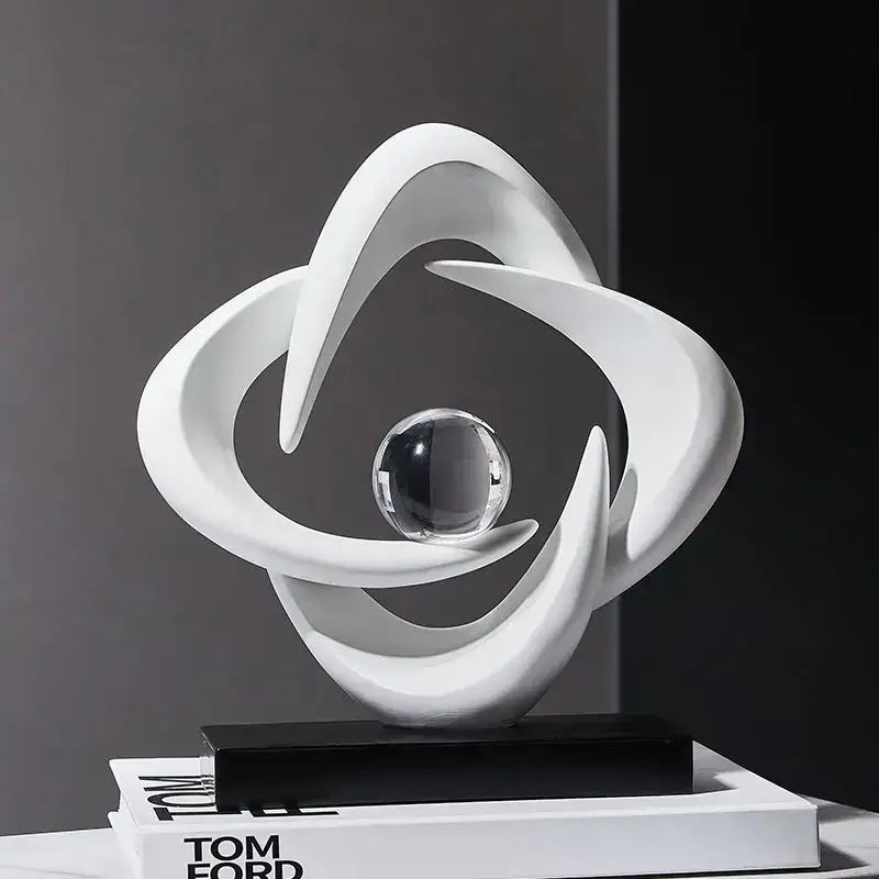 Modern white abstract resin sculpture with flowing curves and central clear glass sphere for living room decorbites decor