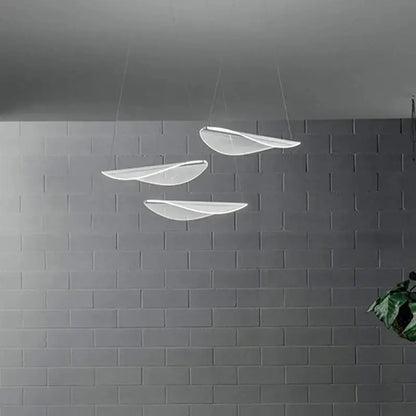 Modern white acrylic leaf pendant lights with translucent blades in a staggered arrangement for dining room decorbites acrylic leaf pendant