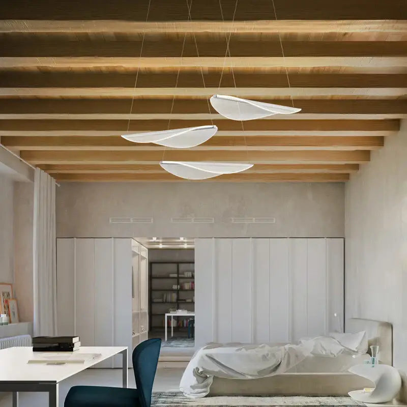 Modern white acrylic leaf pendant lights with sleek wing-like designs hang from ceiling for dining room decorbites acrylic leaf