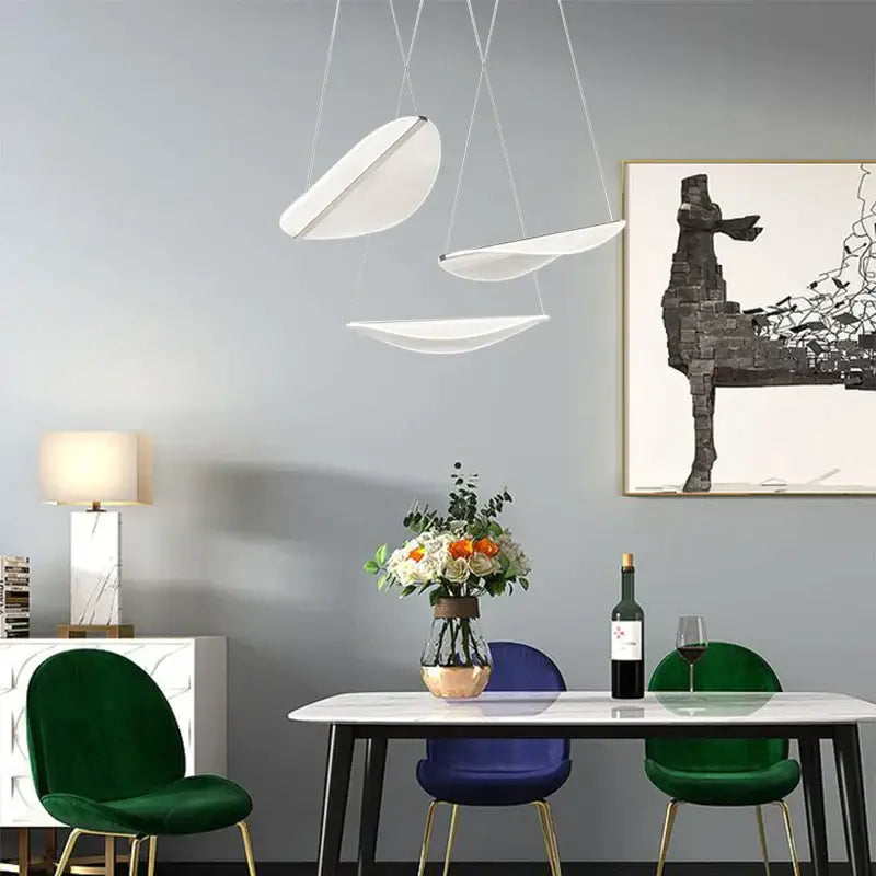 Modern white acrylic leaf pendant lights with sleek curved designs hang from ceiling for dining room decorbites acrylic leaf