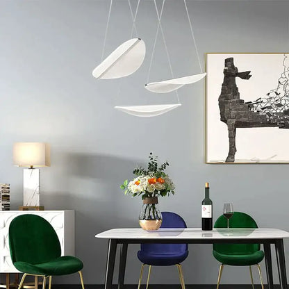 Modern white acrylic leaf pendant lights with sleek curved designs hang from ceiling for dining room decorbites acrylic leaf