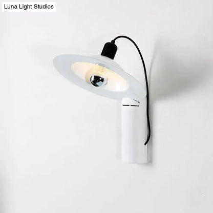 Modern white wall sconce with a sleek curved arm and frosted glass shade for adjustable bedroom reading lighting