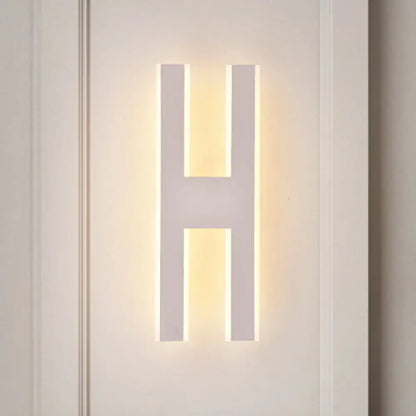 Modern white alphabet wall lamp in sleek acrylic with warm led lighting shaped like letter h for 110v-120v use
