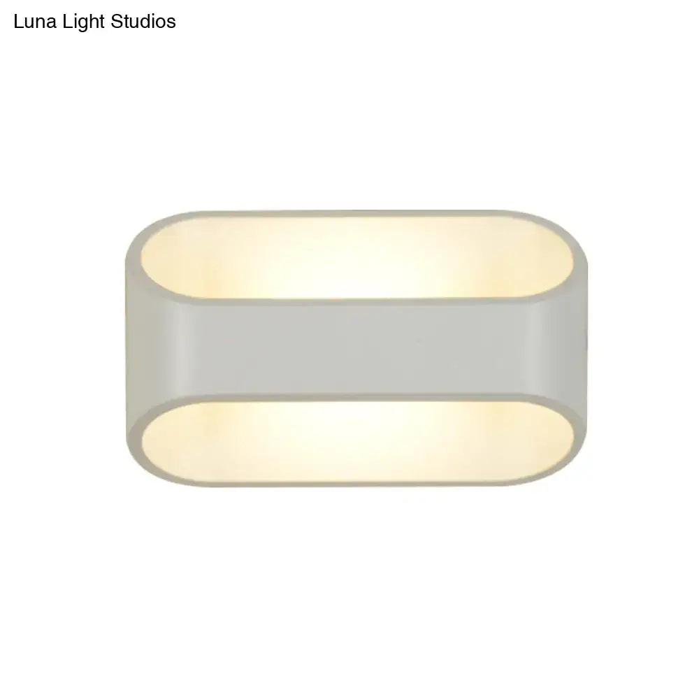 Modern white aluminum led wall sconce with oval shape, sleek matte gray finish, and warm diffused lighting for bathroom
