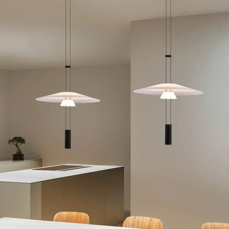 Modern white and black circular pendant light with sleek disc shades and cylindrical fixtures for dining room decorbites circular pendant