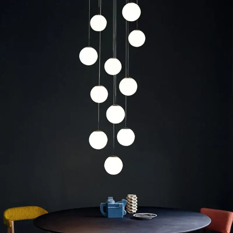 Modern white and black cream glass ball chandelier with spherical pendant lights for staircase decorbites cream glass ball design