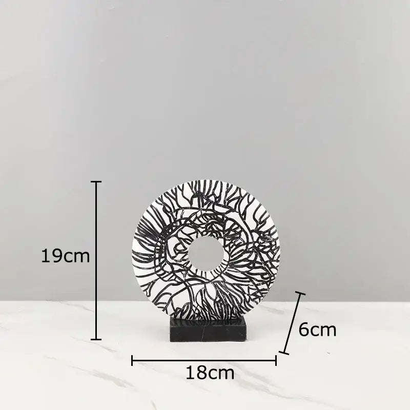 Modern white and black floral decorbites circle ornament with intricate line patterns on black marble base for living room decor