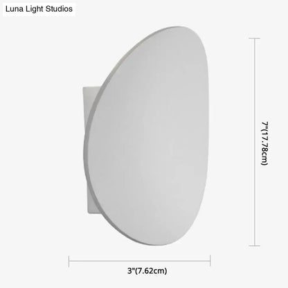 Modern style white and black wall sconce with a sleek oval face and rectangular base for bedroom led spotlight lighting
