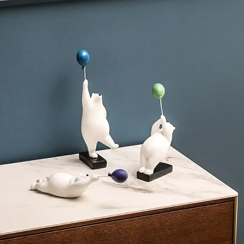 Modern white and blue ceramic flying bear balloon figurines with colorful balloons on black bases for decorbites flying bear decor