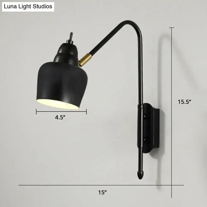 Modern white and brass v-shaped wall light with black matte curved arm and gold accent joint light type for bedroom reading