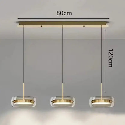 Modern gold-toned pendant light with three clear glass shades for dining room featuring remote dimming control