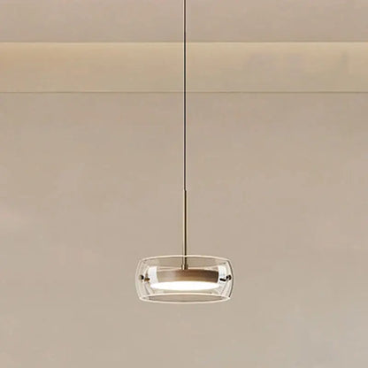 Modern white and clear glass ring pendant light with brushed brass finish and remote dimming for dining room use