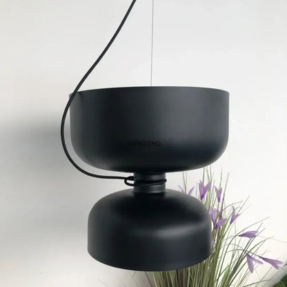 Black matte pendant light with two stacked circular shades, a decorbites designer iron chandelier for modern dining rooms