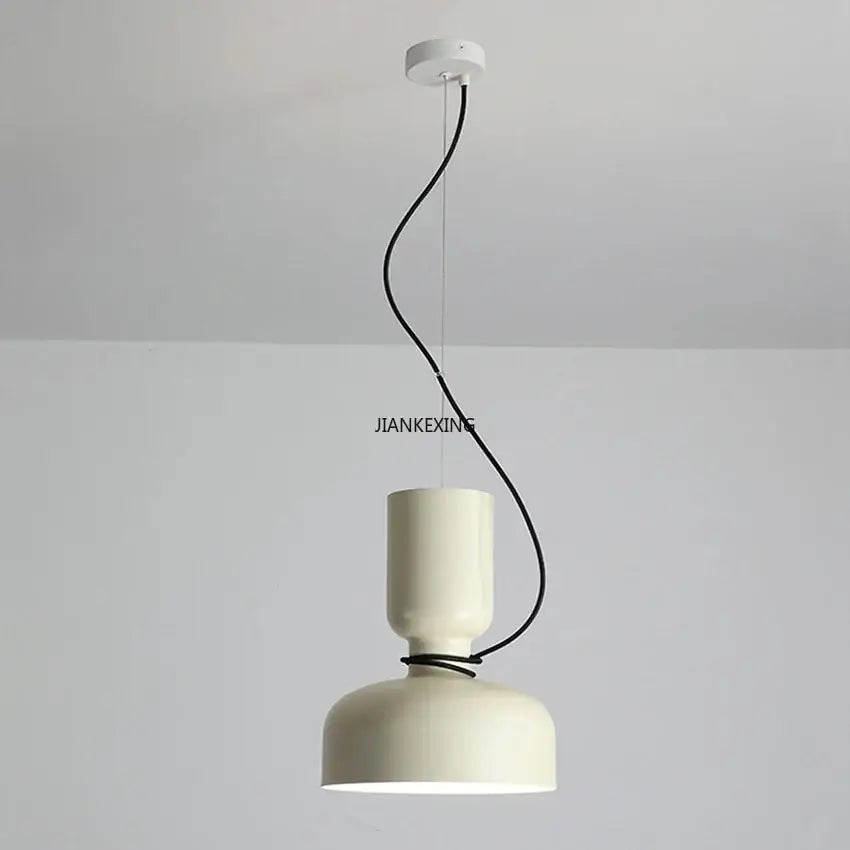 Cream-colored cylindrical ceramic pendant light with black cord for dining room decorbites designer iron chandelier