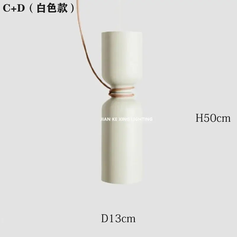 Modern white and copper ceramic pendant light with sleek cylindrical design and thin brown cord for dining room decorbites designer iron chandelier