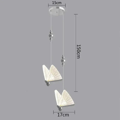 Silver-finished modern butterfly pendant lights with translucent patterned wings and beaded accents for bedroom decor