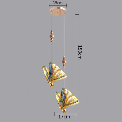 Modern white and gold butterfly pendant lights featuring gold-toned butterfly design with iridescent wings and beaded accents for decorbites butterfly pendant lighting