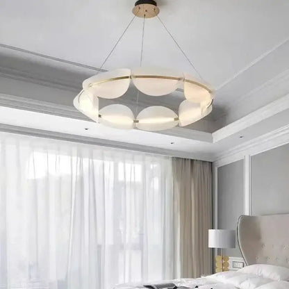 Modern white and gold circular led pendant light with frosted glass panels and metal accents for living room decorbites circular led