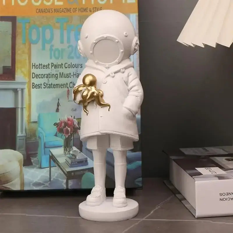 Modern white and gold deepsea diver sculpture featuring an astronaut figurine with a golden octopus for living room decor