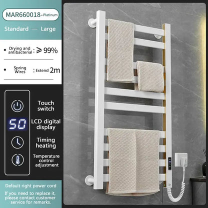 Modern white and gold electric towel radiator with digital temperature control and bathroom storage shelf for warm towels