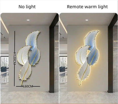 Modern white and gold feather led wall lamp featuring three intertwined illuminated feathers in soft blue and white tones