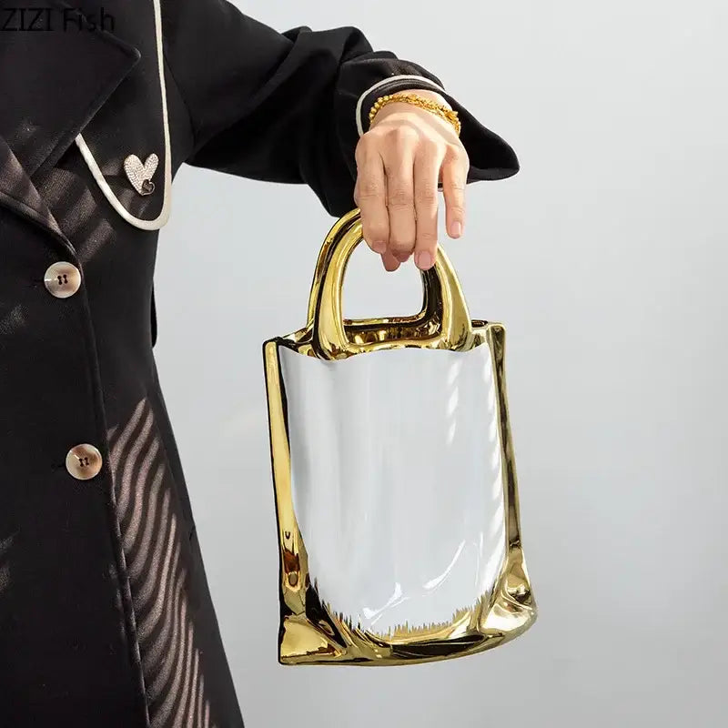 Glossy gold and white handbag ceramic vase with structured modern design for living room decorbites golden handbag decor