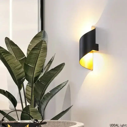 Modern white and gold outdoor wall lamp with spiral design and warm yellow lighting for patio or outdoor wall use