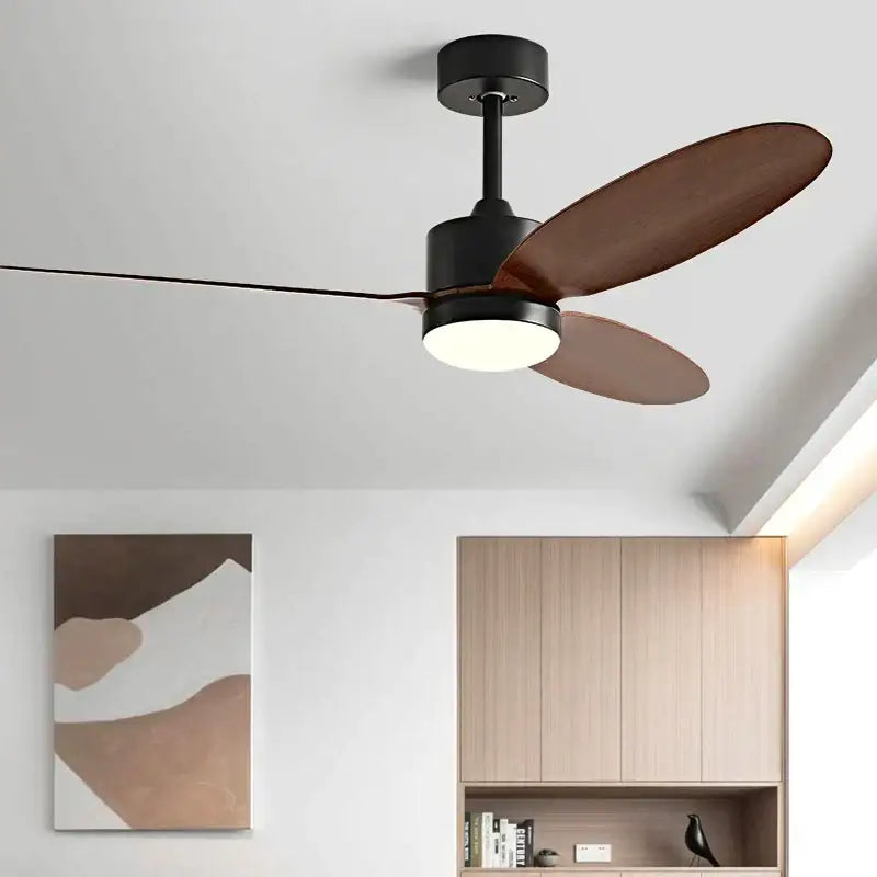 Modern dc ceiling fan with sleek black metal frame, brown wooden blades, integrated light fixture, and remote control