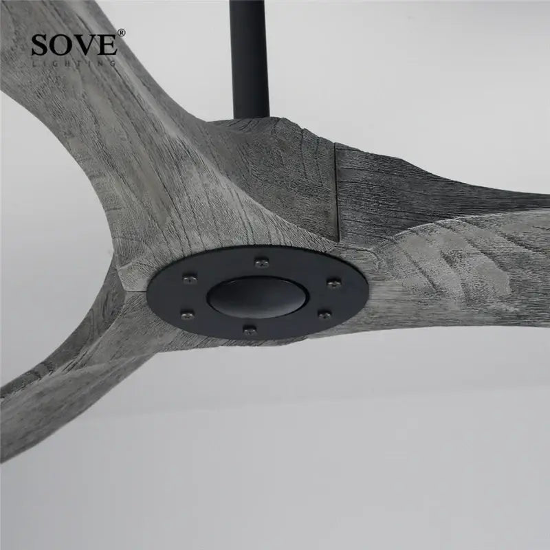 Modern white and light wood dc ceiling fan with gray wood-textured blades and black metal hub with remote control
