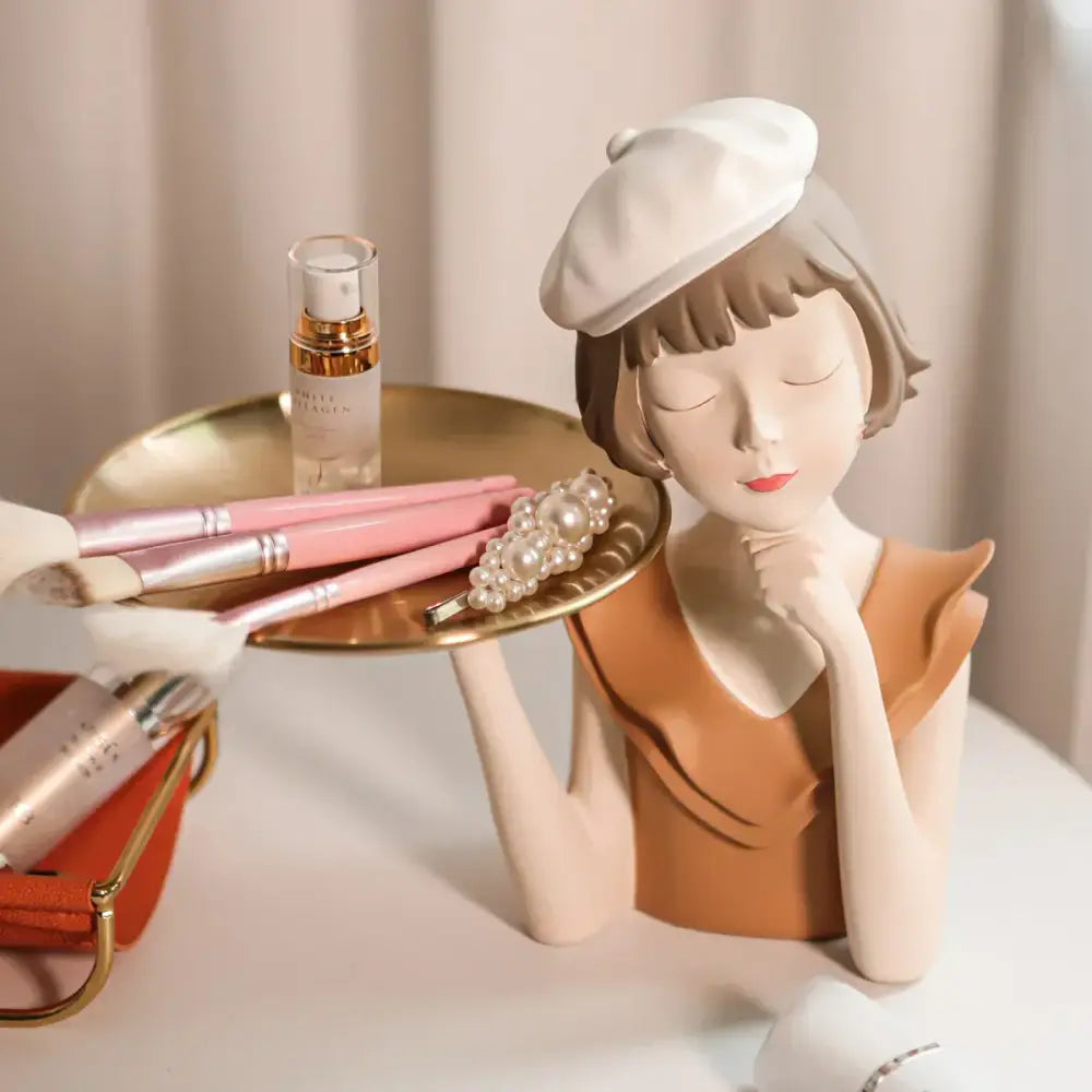 Porcelain balloon girl bust sculpture with closed eyes white beret and orange top for modern living room decor