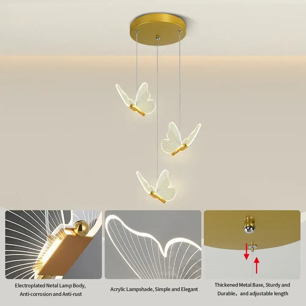 Modern white and warm gold butterfly pendant light with three illuminated acrylic lampshades and warm gold finish