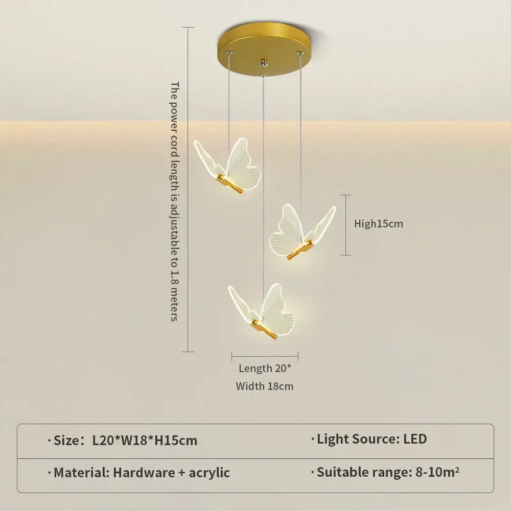 Gold-toned ceiling-mounted pendant light with three translucent acrylic butterflies in warm gold finish for bedroom use