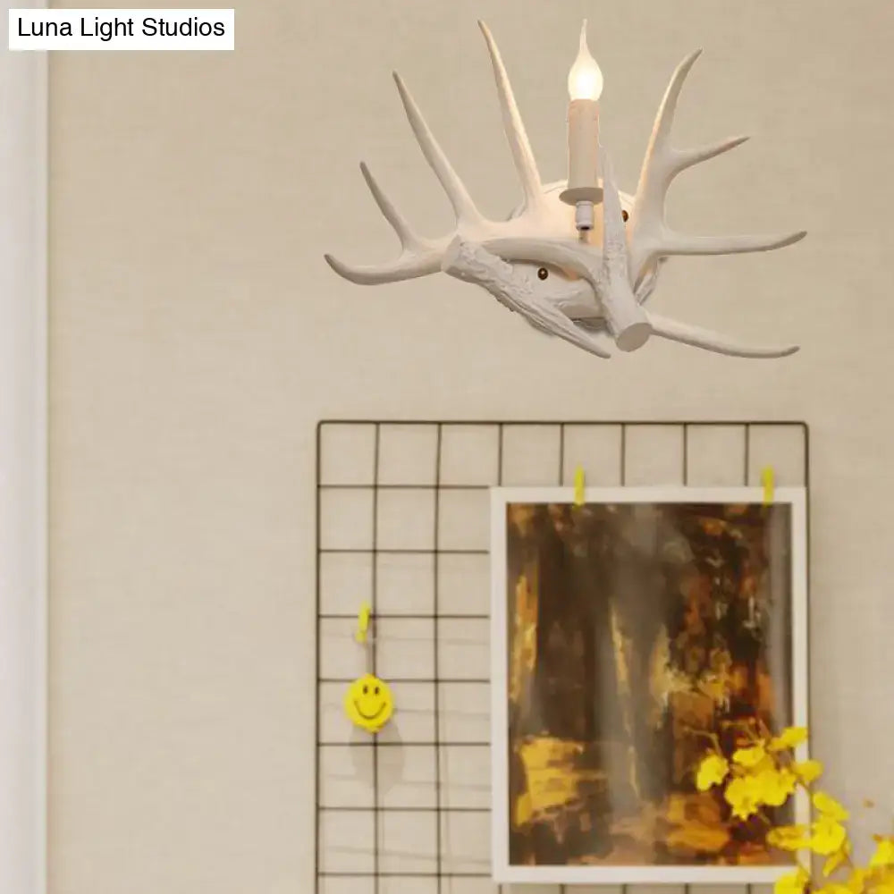 Modern white antler resin shade wall sconce with single candle-style bulb for living room lighting