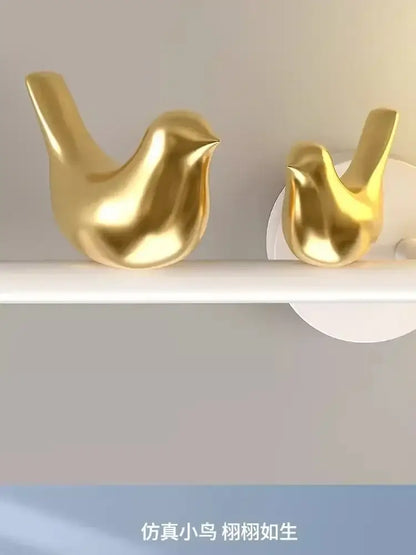 Modern white bird wall lights featuring two golden glossy bird wall lights with smooth minimalist decorbites design