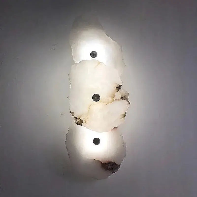 Modern white and black alabaster wall lamp with frosted glass shades and dark circular fixtures for luxury decorbites brass wall lamp