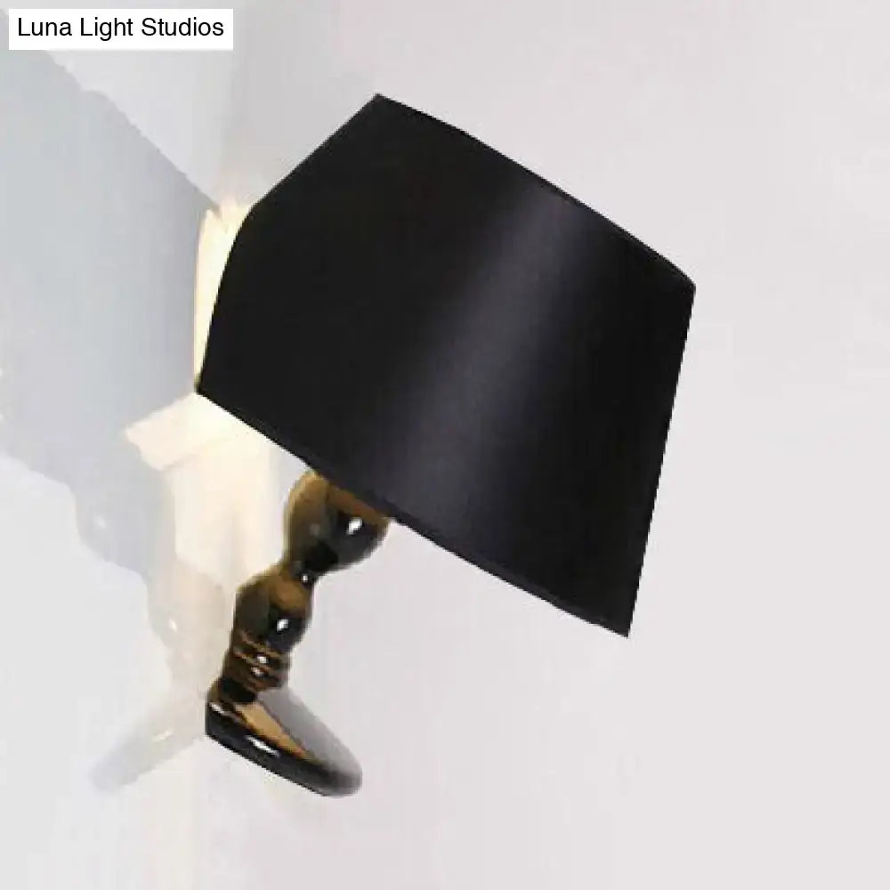 Modern white black cone ceramic wall sconce with black satin lampshade and glossy gold-toned ceramic base for bedroom lighting