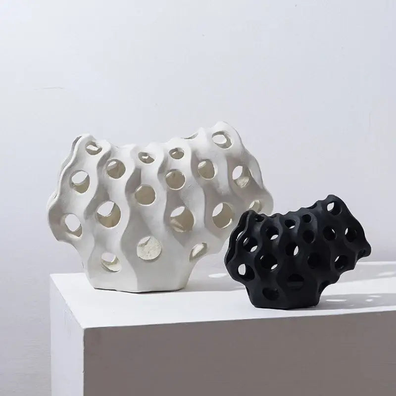 Modern white and black coral geometric resin sculpture featuring organic porous design for living room decor