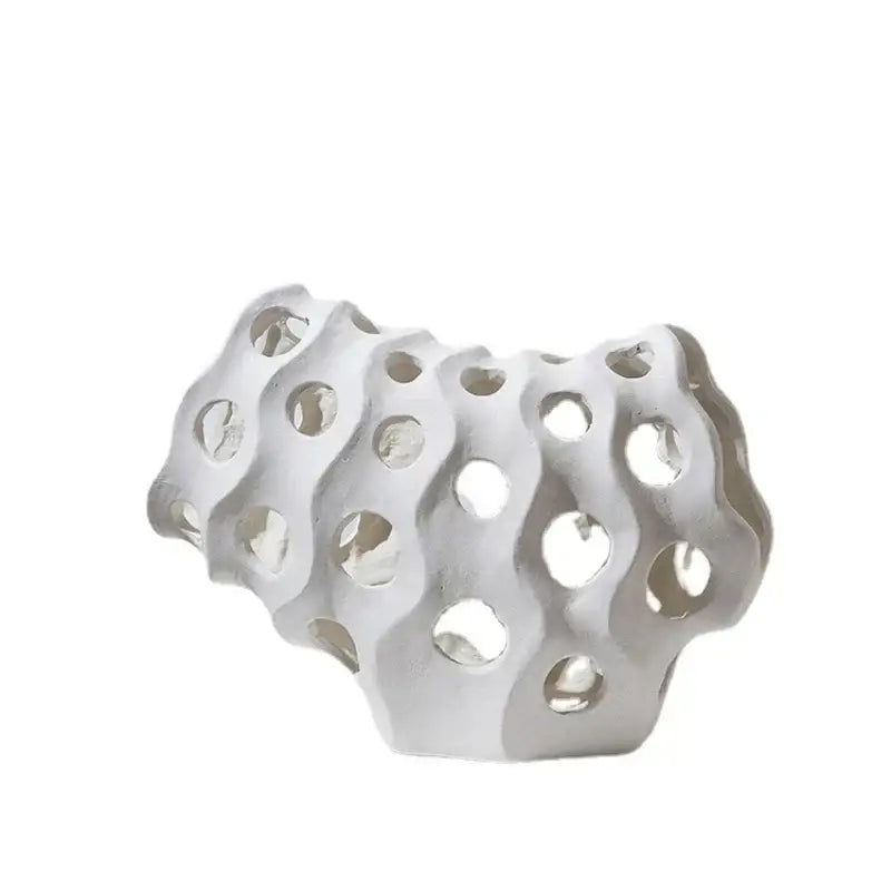 Modern white ceramic coral geometric resin sculpture with wavy organic form and circular cutouts for living room decor